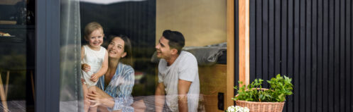 Family photographed through clean window