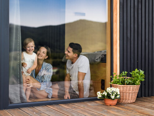 Family photographed through clean window